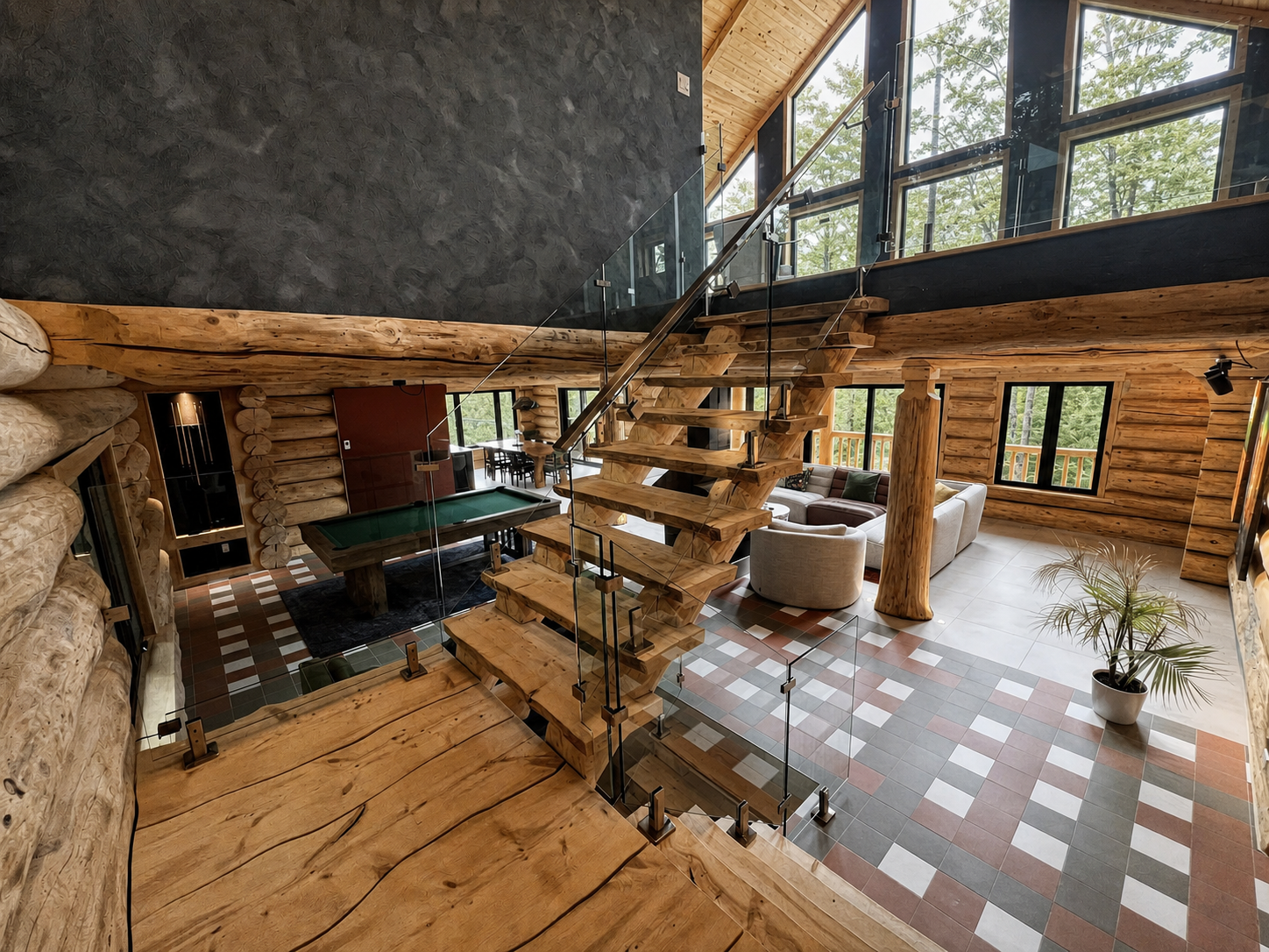 Intérieur du modèle Signature avec escalier sculptural en bois, mezzanine vitrée et aire de vie ouverte