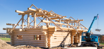 Wooden timber, construction site, construction of  wooden house, building a wooden house, crane at construction site, unfinished wooden house